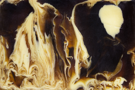 Brown and yellow soap streaks texture closeupの写真素材