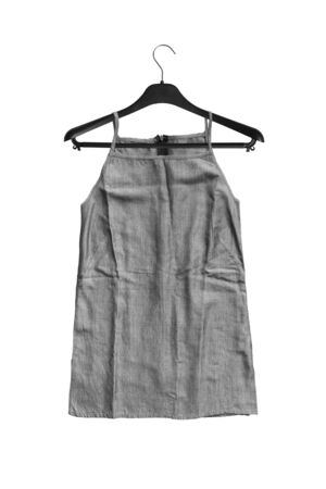Basic grey top hanging on black clothes rack isolated over whiteの写真素材