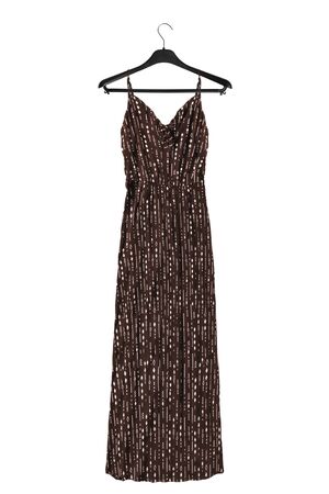 Brown long sundress on black clothes rack isolated over whiteの写真素材