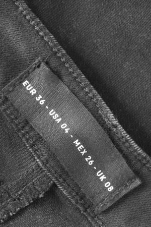 04 size clothes label on black denim background closeupの写真素材