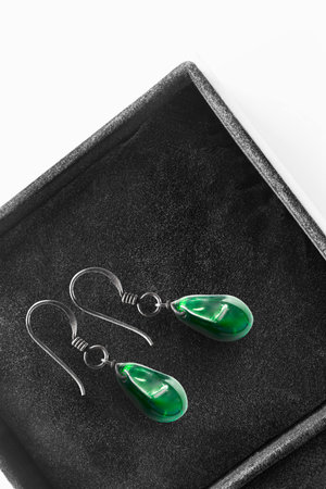 Elegant green crystals earrings in black jewel box