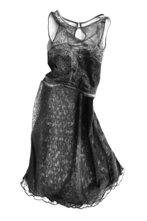 Black lacy chiffon sleeveless flared dress isolated over whiteの写真素材
