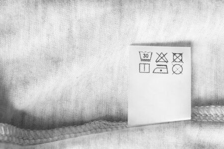 Care clothes label on white cotton background closeupの写真素材