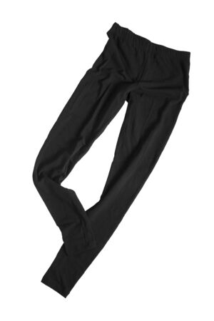 Black crumpled cotton sport leggings isolated over whiteの写真素材