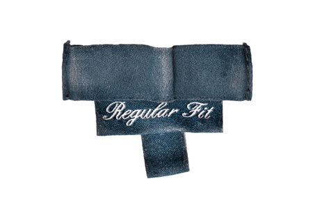 Blue textile clothes label says regular fit isolated over white