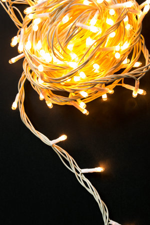 Yellow flash lights garland on black background