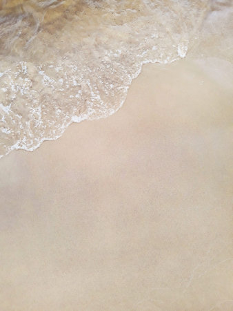 Yellow sand beach and water edge as a background