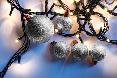 Silver glitter christmas balls and led lights garlands