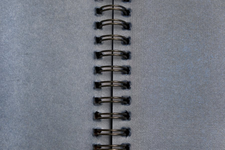 Dark blue blank spring sketchbook pages closeup as a backgroundの写真素材