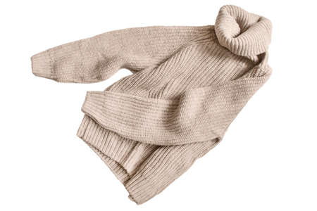 Beige knit turtle neck sweater isolated over whiteの写真素材