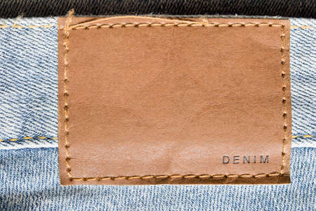Clothing label says denim closeup on blue jeansの写真素材