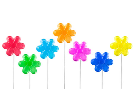 Colorful flower shaped lollipops isolated on white backgroundの写真素材