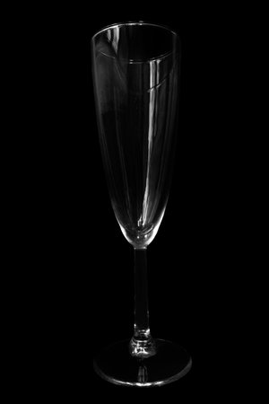 Empty champagne glass isolated over blackの写真素材