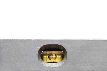 Old flat spirit level closeup on white backgroundの写真素材