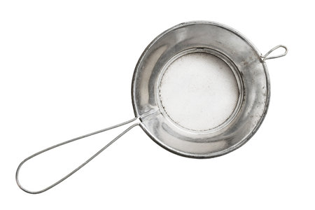 Old metal handle mesh sieve isolated over white