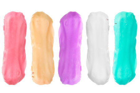 Colorful glazed eclair sweet cakes on white background