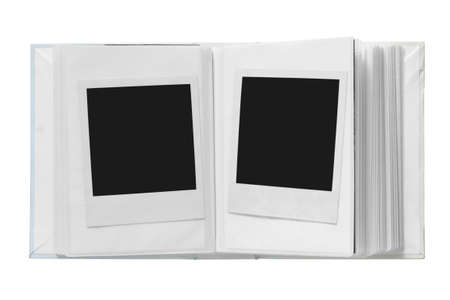 Blank polaroid cards in photo album isolated on white backgroundの写真素材