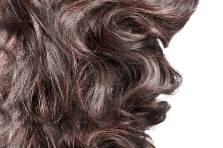Brown wavy hair closeup on white backgroundの写真素材