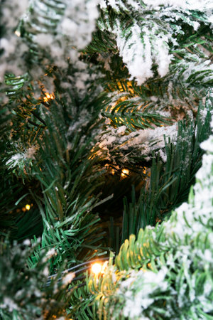 Led lights in artificial christmas tree branches closeupの写真素材