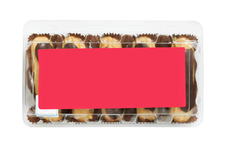 Chocolate eclair cakes in plastic box on white background