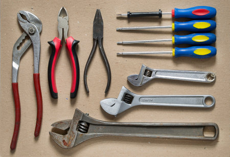 Some old hand work tools on cardboard backgroundの写真素材