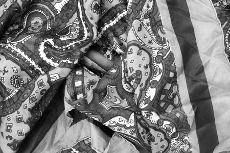 Black and white draped silk fabric as a backgroundの写真素材