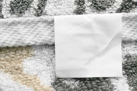 Blank clothing label on terry cloth as a backgroundの写真素材
