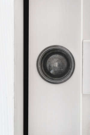 Sliding white wooden door handle closeupの写真素材
