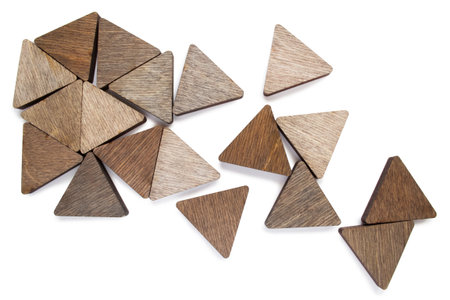 Blank wooden triangle pieces on white background