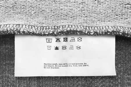 Care instructions clothing label on gray fabric back sideの写真素材