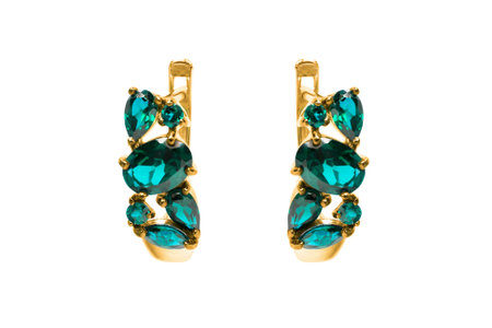 Beautiful blue topaz gold earrings isolated on white backgroundの写真素材