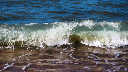 Sea foam ashore wave