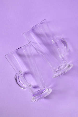 Clean hot drinks glasses on purple backgroundの写真素材