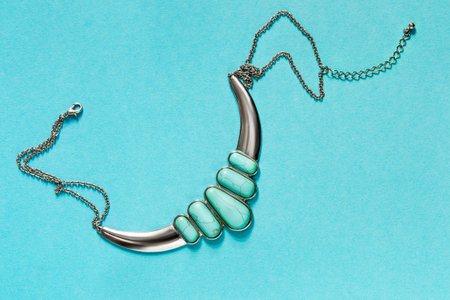 Vintage silver turquoise necklace on blue backgroundの写真素材