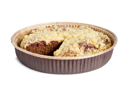 Cut crumble brownie cake in paper dish isolated on white backgroundの写真素材