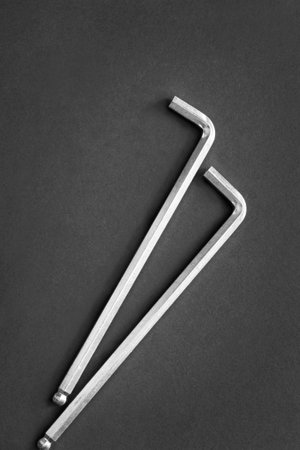 Two steel hex screwdrivers on black backgroundの写真素材