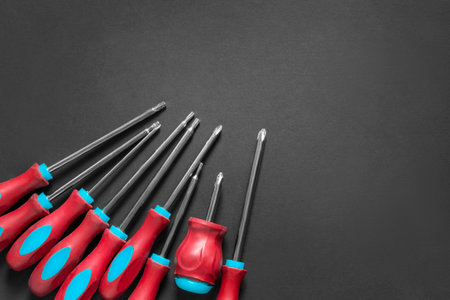 Set of crosshead and hex screwdrivers on black backgroundの写真素材