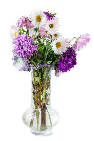 Wild summer flowers bouquet in glass vase isolated on white backgroundの写真素材