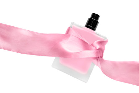 Perfumery bottle tied with pink satin ribbon isolated on white backgroundの写真素材