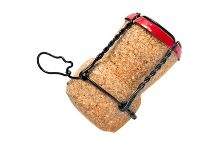 Champagne cork with wire cage isolated on white backgroundの写真素材