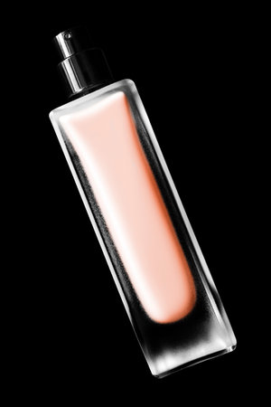 Matte glass beige perfume spray bottle isolated on black backgroundの写真素材