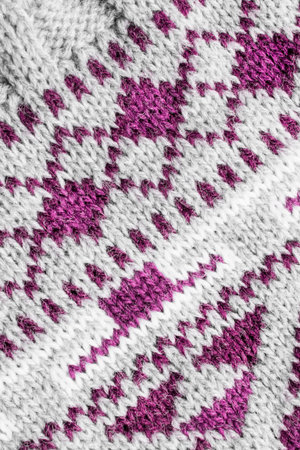 Abstract white and purple wool knit background closeup