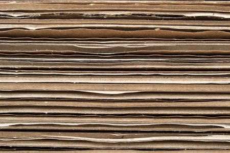 Brown corrugated cardboard texture closeup as a backgroundの写真素材