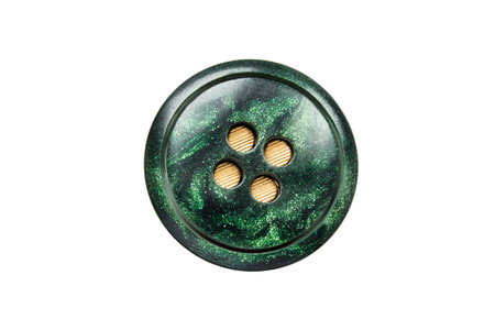 Green plastic clothes button isolated on white background
