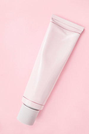 Blank pink cosmetic tube pack on pink backgroundの写真素材