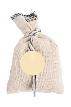 Beige fabric sachet pouch isolated on white backgroundの写真素材