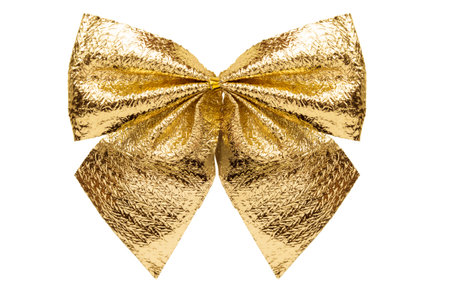 Golden metallic decorative bow isolated on white backgroundの写真素材