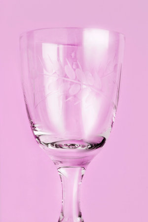 Vintage clean wineglass closeup on lavender color backgroundの写真素材
