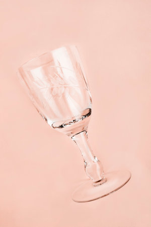 Clean wine glass on beige studio backgroundの写真素材