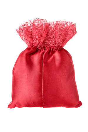 Red satin handmade small pouch isolated on white backgroundの写真素材